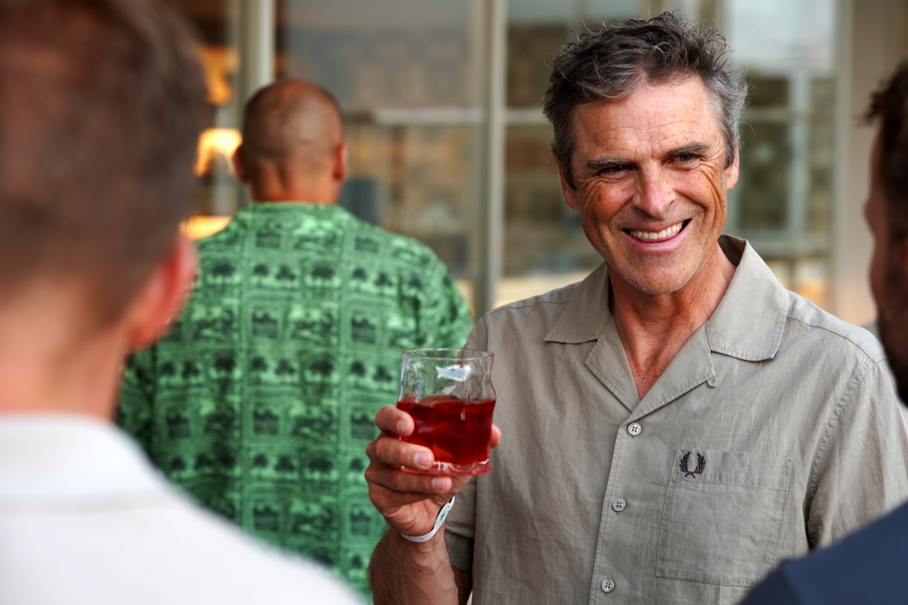 Group laughing with drinks